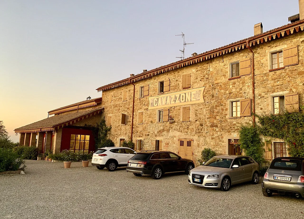 Agriturismo farmhouse at golden hour.