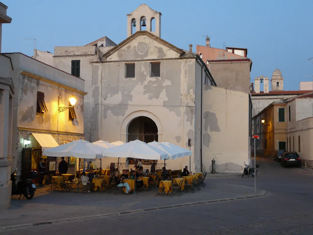 Cafe tables in a square in Alghero.