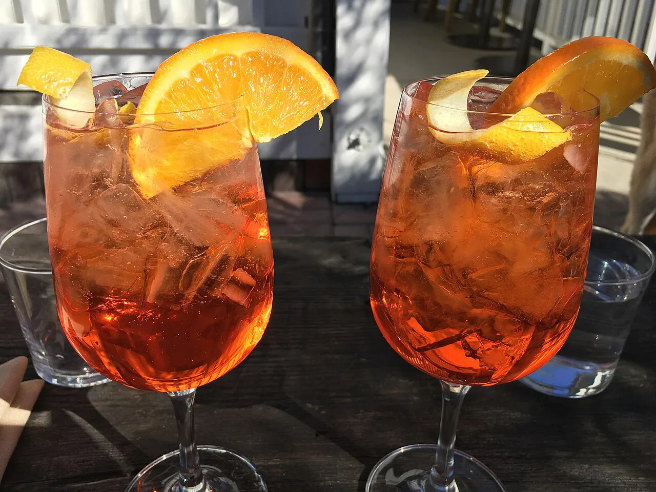 Two Aperol spritz glasses.