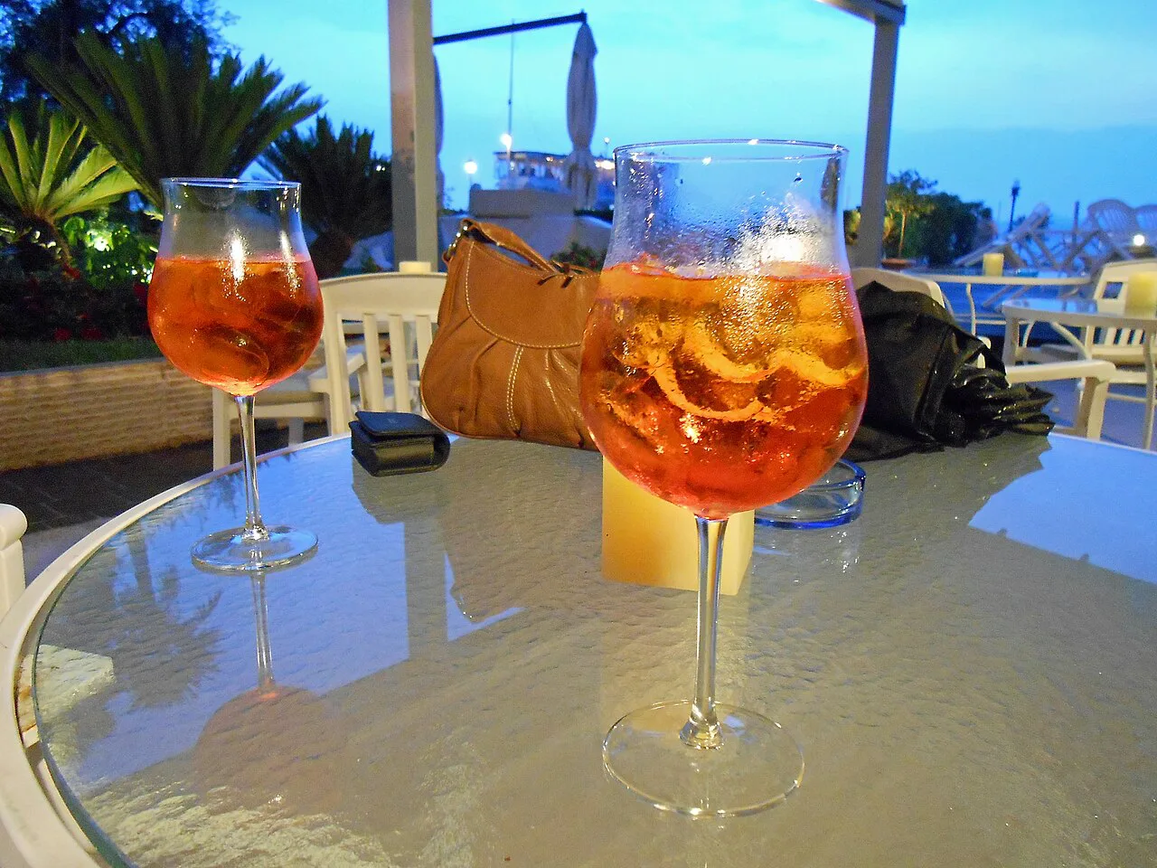 Spritz cocktails on a terrace table.