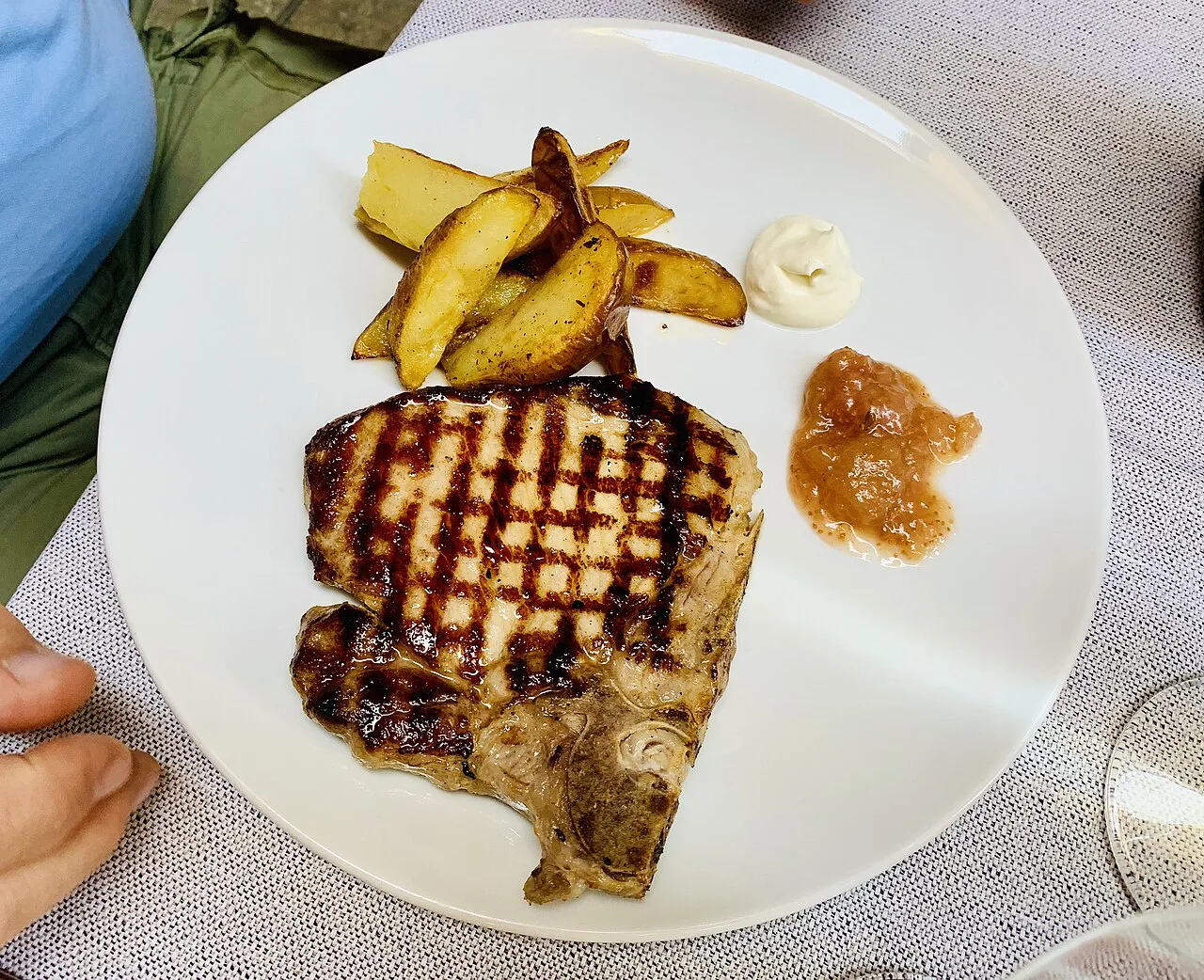 Grilled pork chop at a restaurant in Modena.
