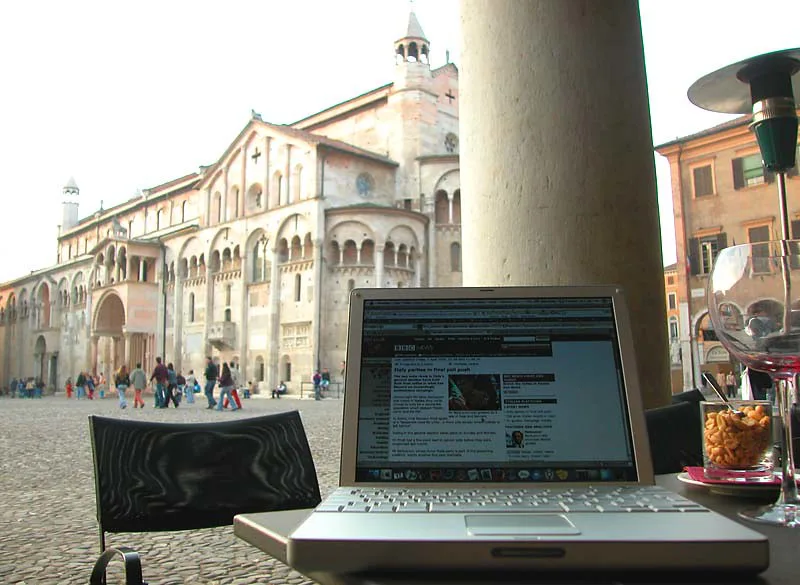 Cafe table with a view of the cathedral in Modena.