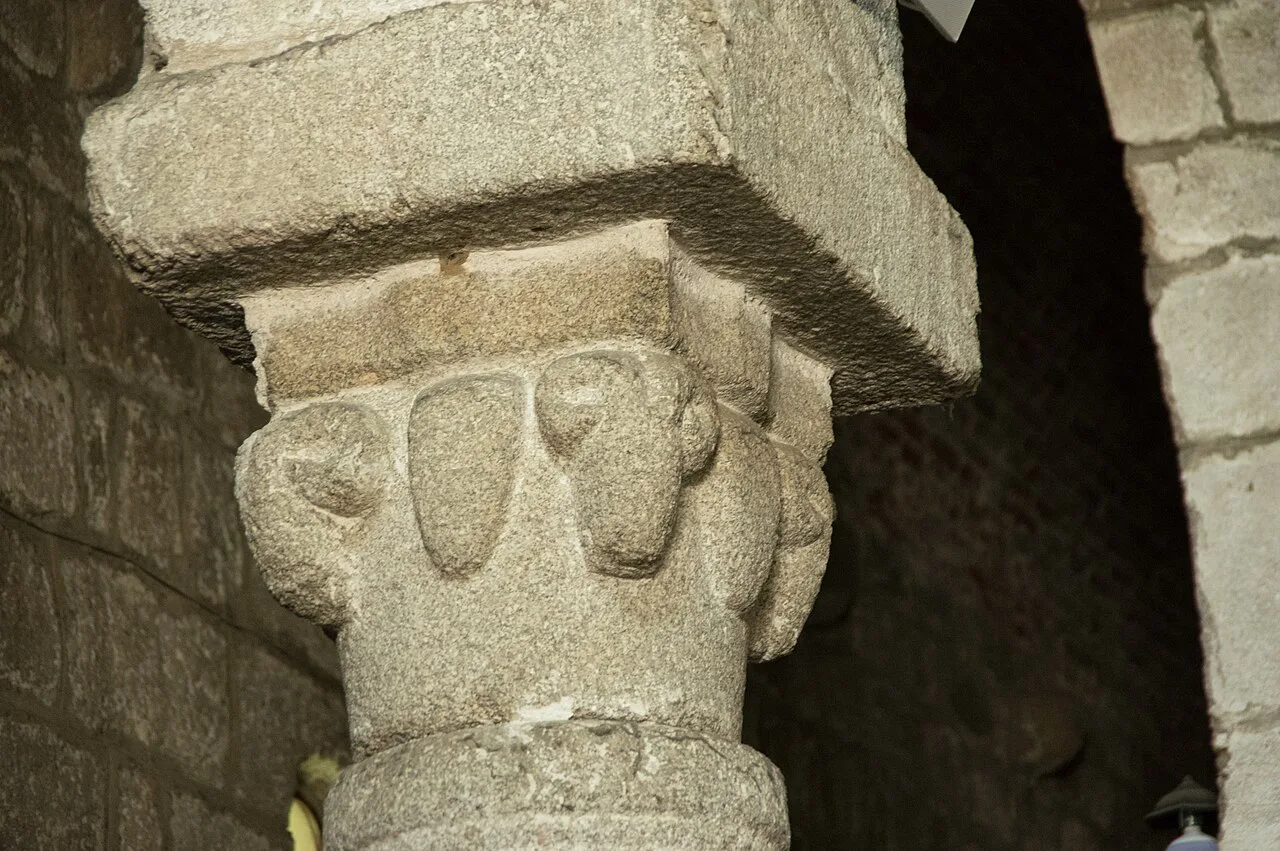 Carved stone capital inside San Simplicio in Olbia.