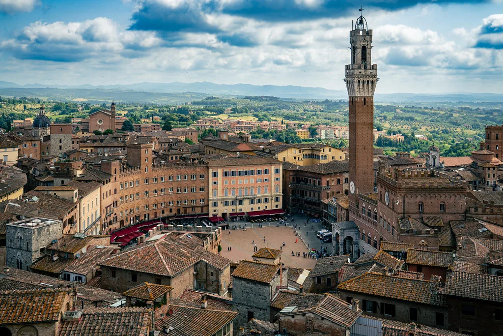 Piazza del Campo and the Torre del Mangia seen from above in Siena.
