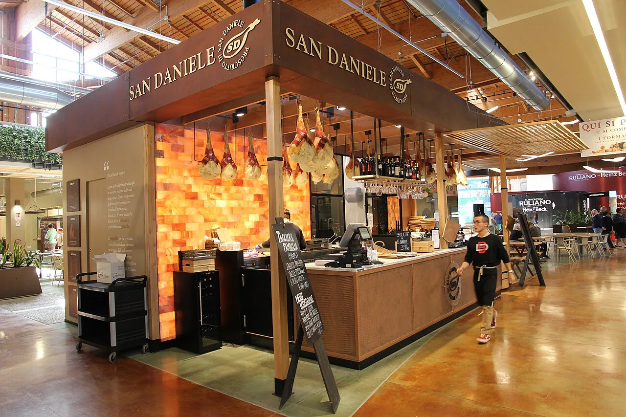 A San Daniele food counter at Fico Eataly World in Bologna.