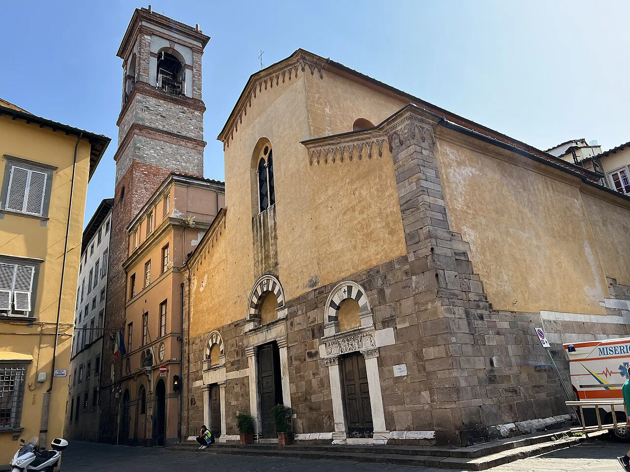 A church and bell tower in Lucca's old town.