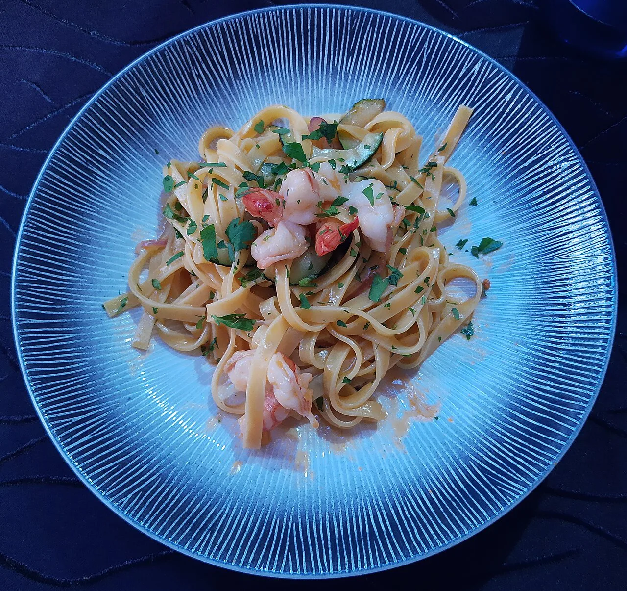 A plate of tagliatelle with seafood.