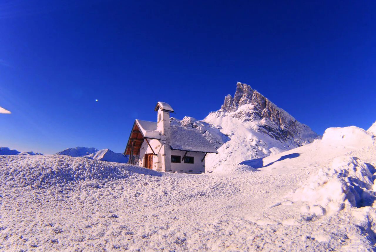 A mountain hut in the snow at Cortina d'Ampezzo.