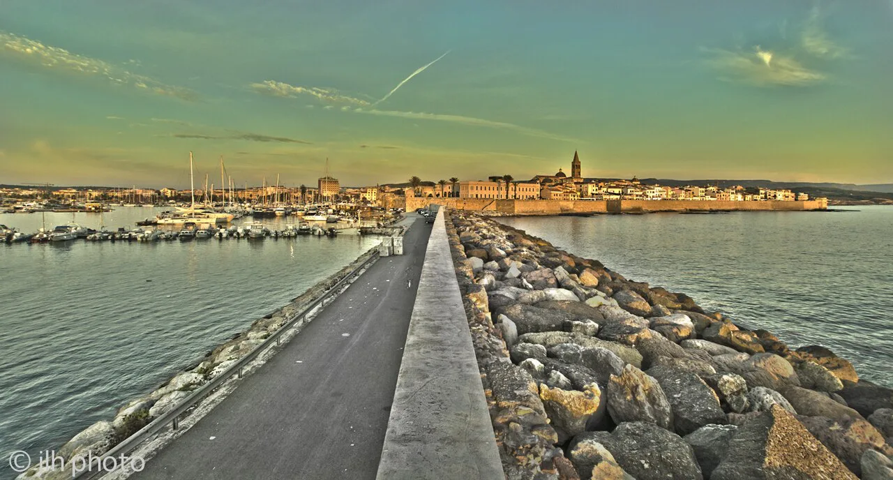 Alghero old town and harbour at sunset.