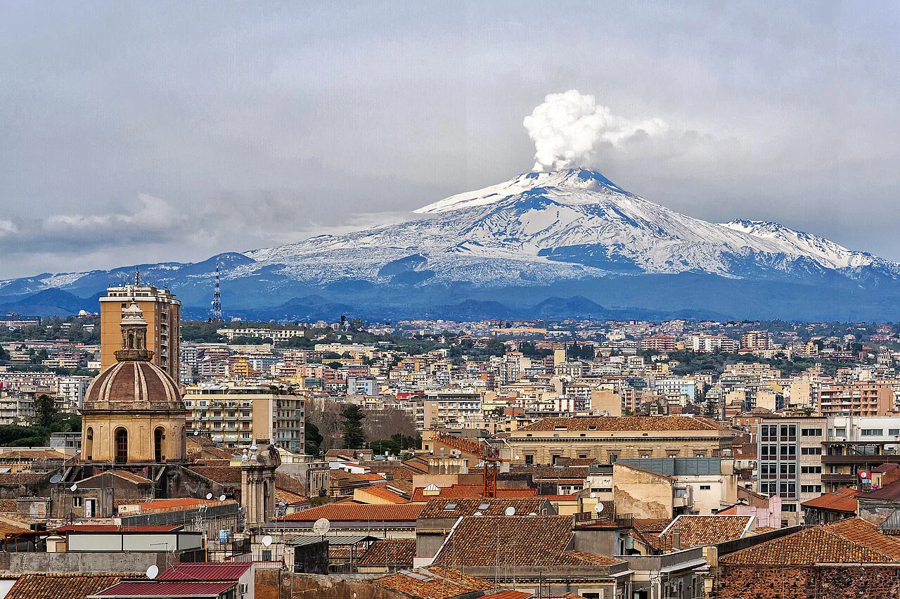 Catania rooftops with Mount Etna behind.