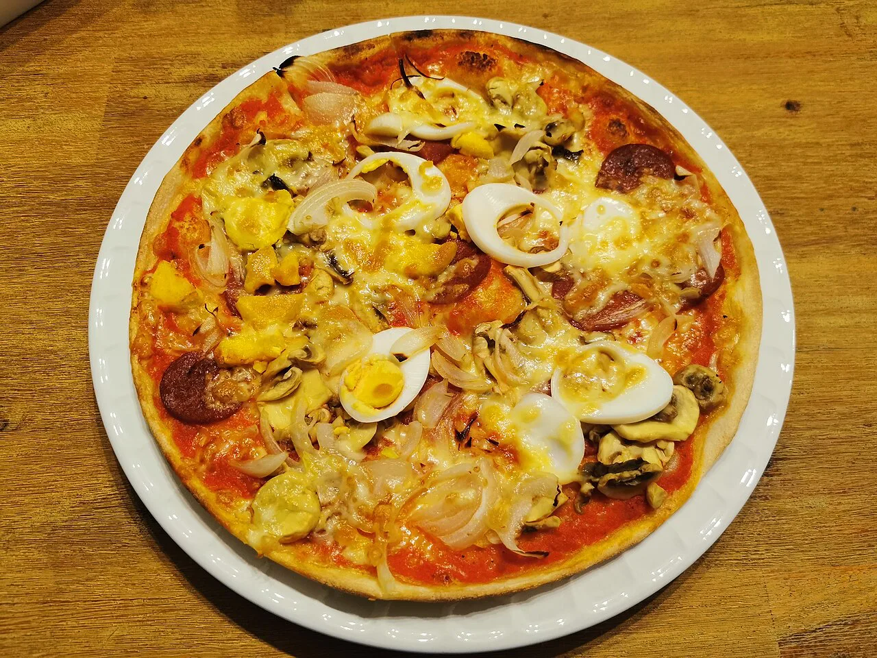 Pizza with mushrooms and egg.