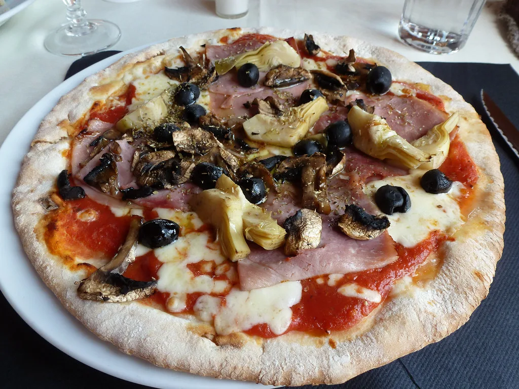 Pizza topped with artichokes and olives in San Gimignano.