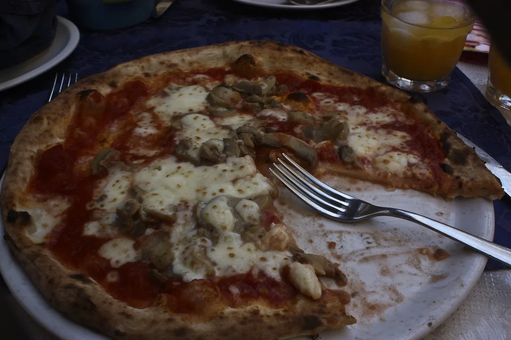 Pizza with mushrooms and cheese in Sorrento.