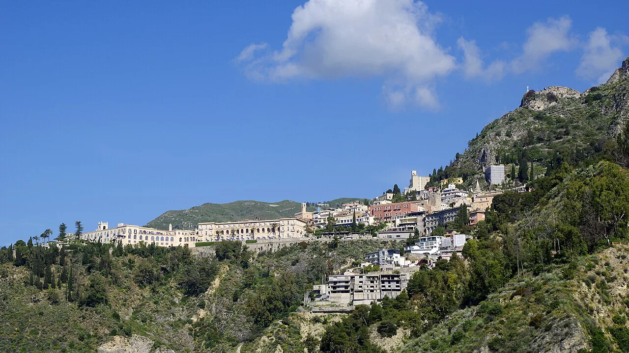 The hillside town of Taormina seen from a distance.