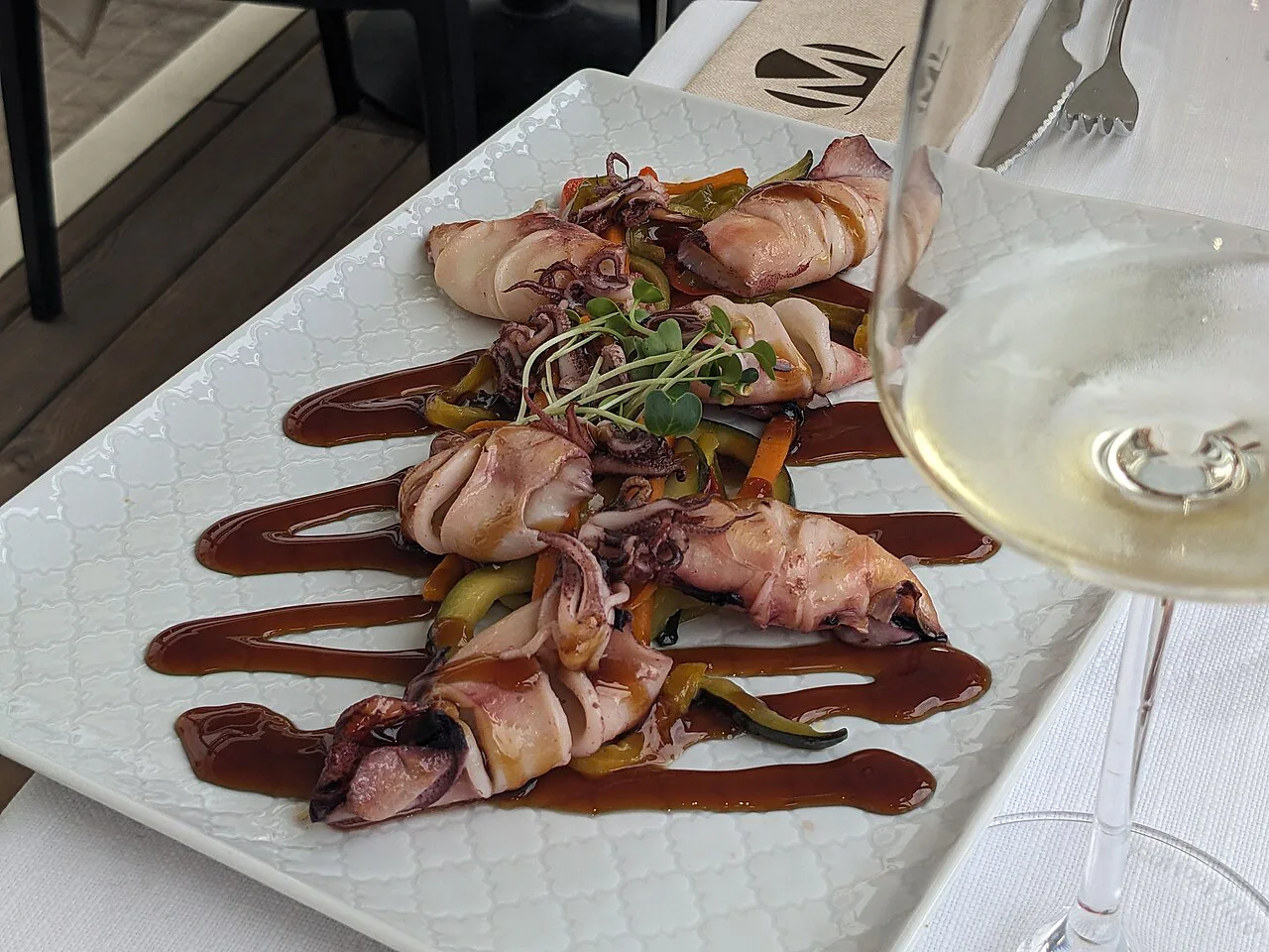 Grilled squid on a plate in Alghero.