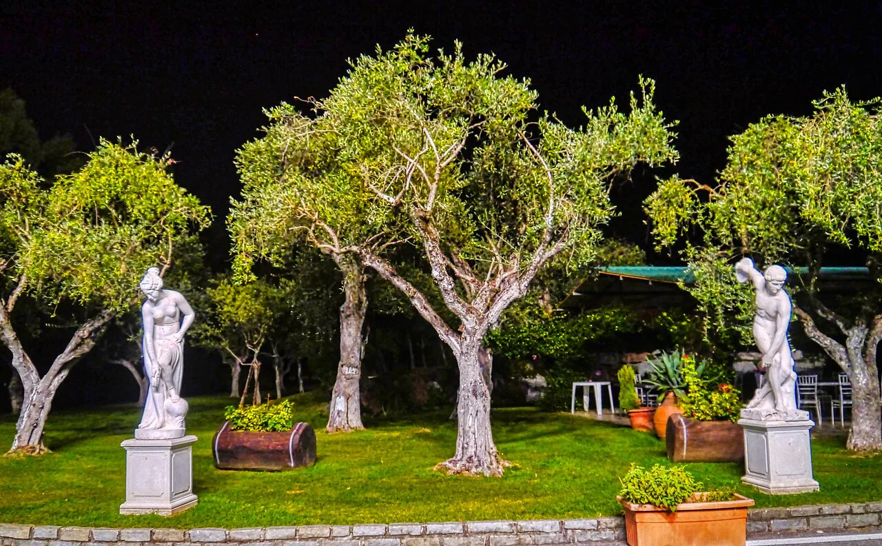 Restaurant garden with statues near Como.