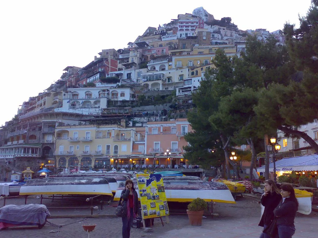 Positano's pastel houses climbing the hillside above the beach.