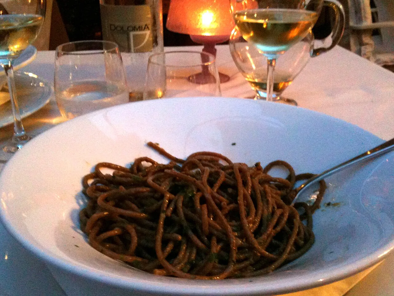 Dark bigoli with anchovy sauce in Venice.