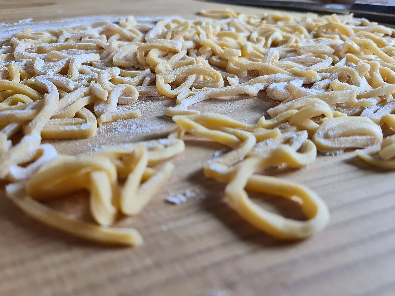 Hand-shaped Curzùl pasta before cooking.