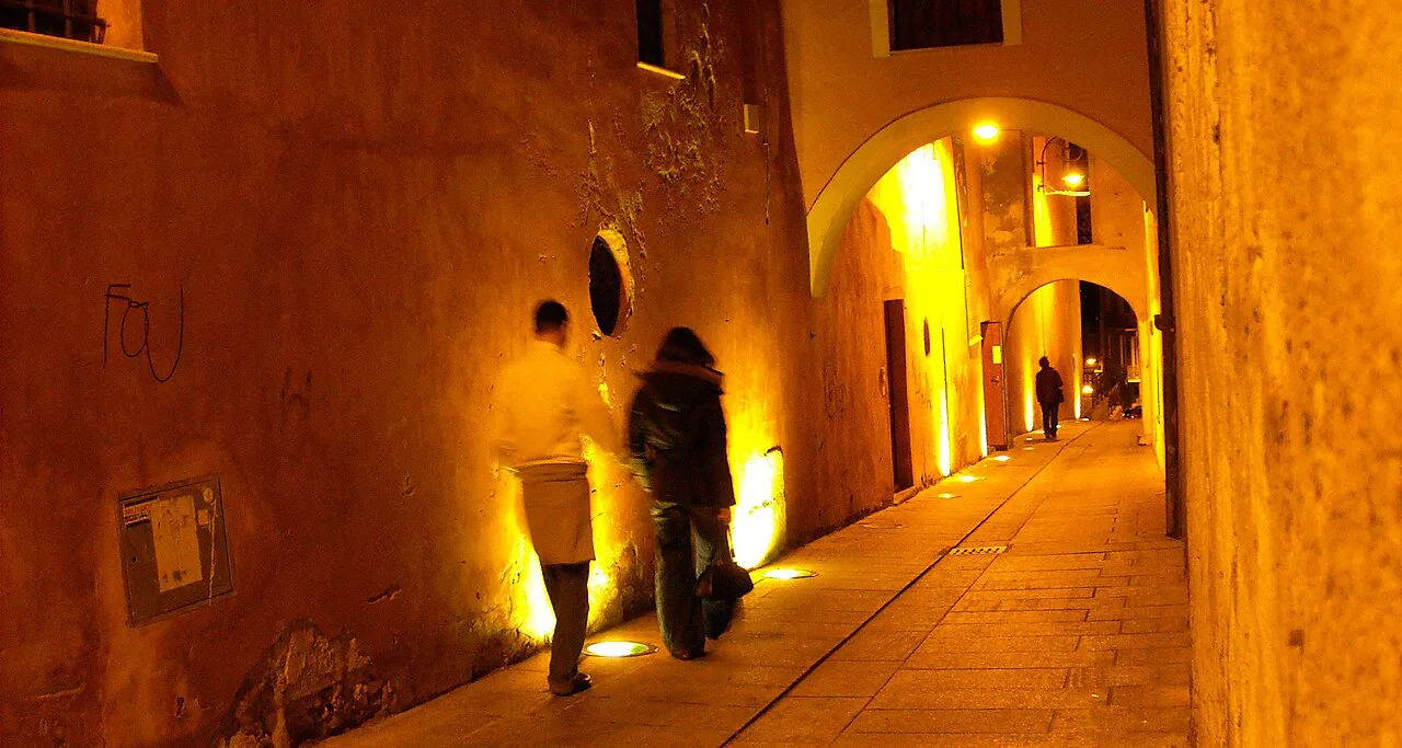 Lit old-town passage in Cagliari.