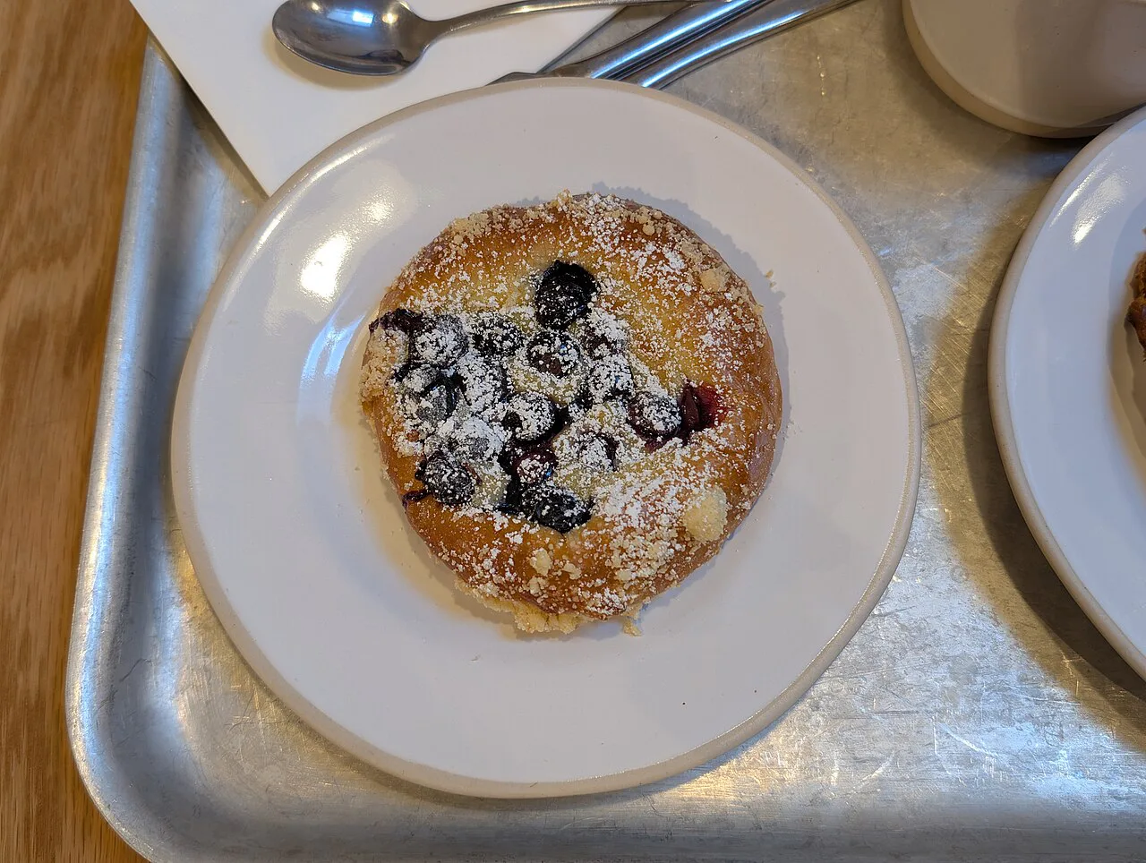 A brioche with blueberry and custard.