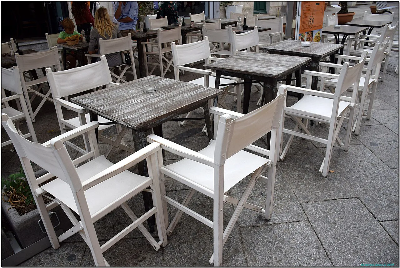 Outdoor tables at an Olbia restaurant.