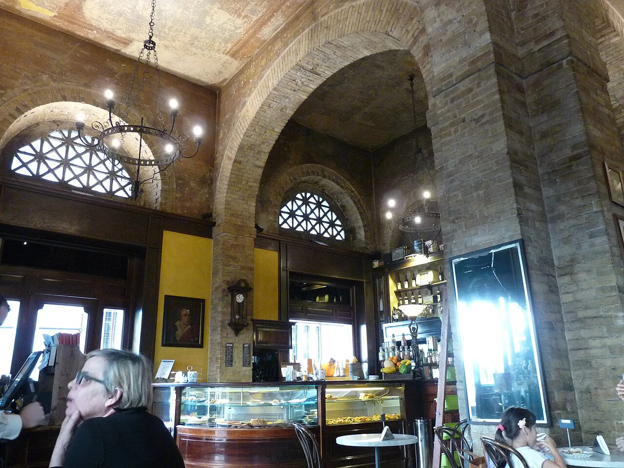 Counter and arches inside a Cagliari café.