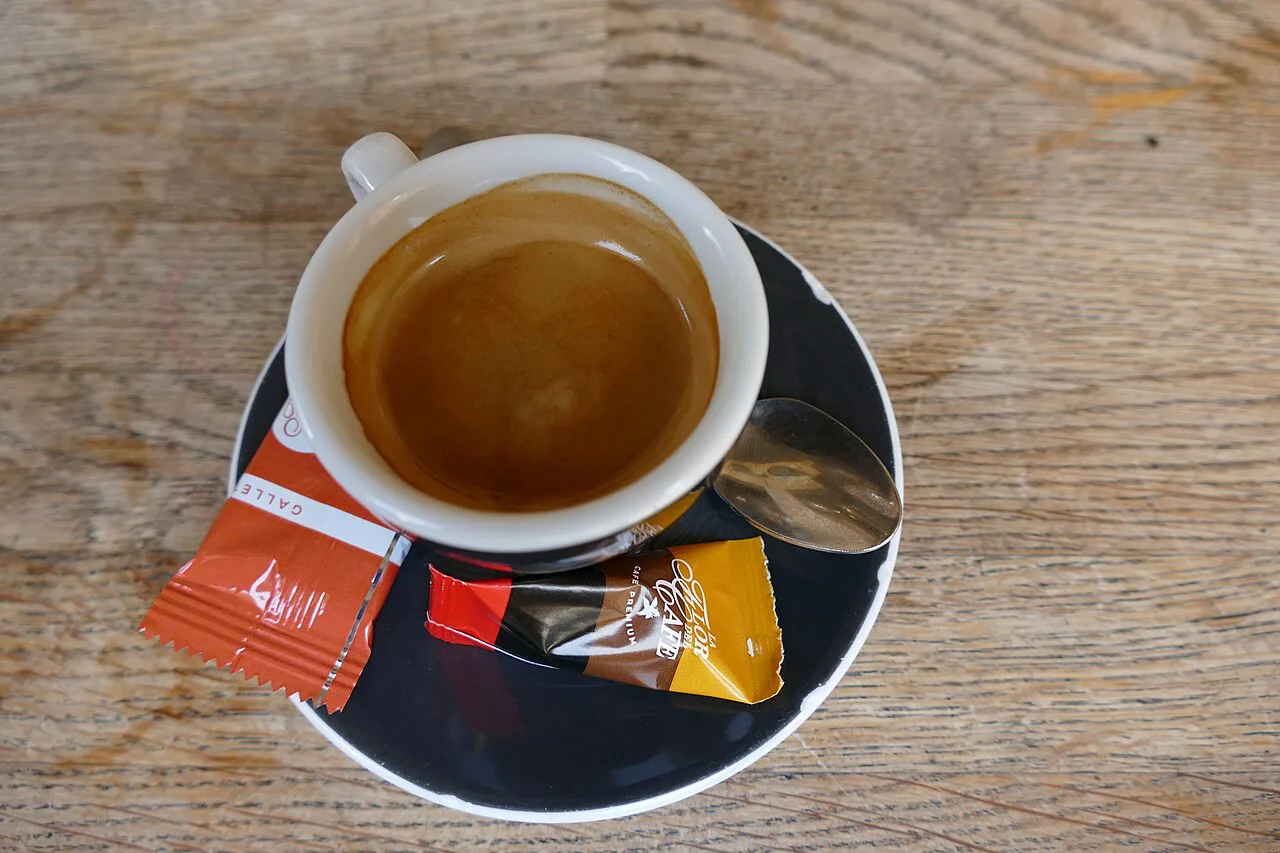 A cup of espresso on a saucer.