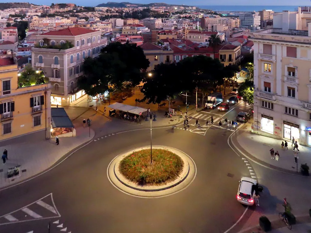 Piazza Costituzione in Cagliari at dusk.