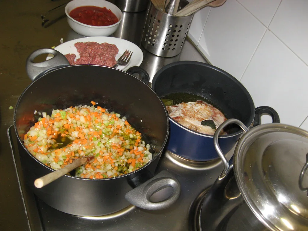 Risotto cooking in a pan at a cooking class in Florence.