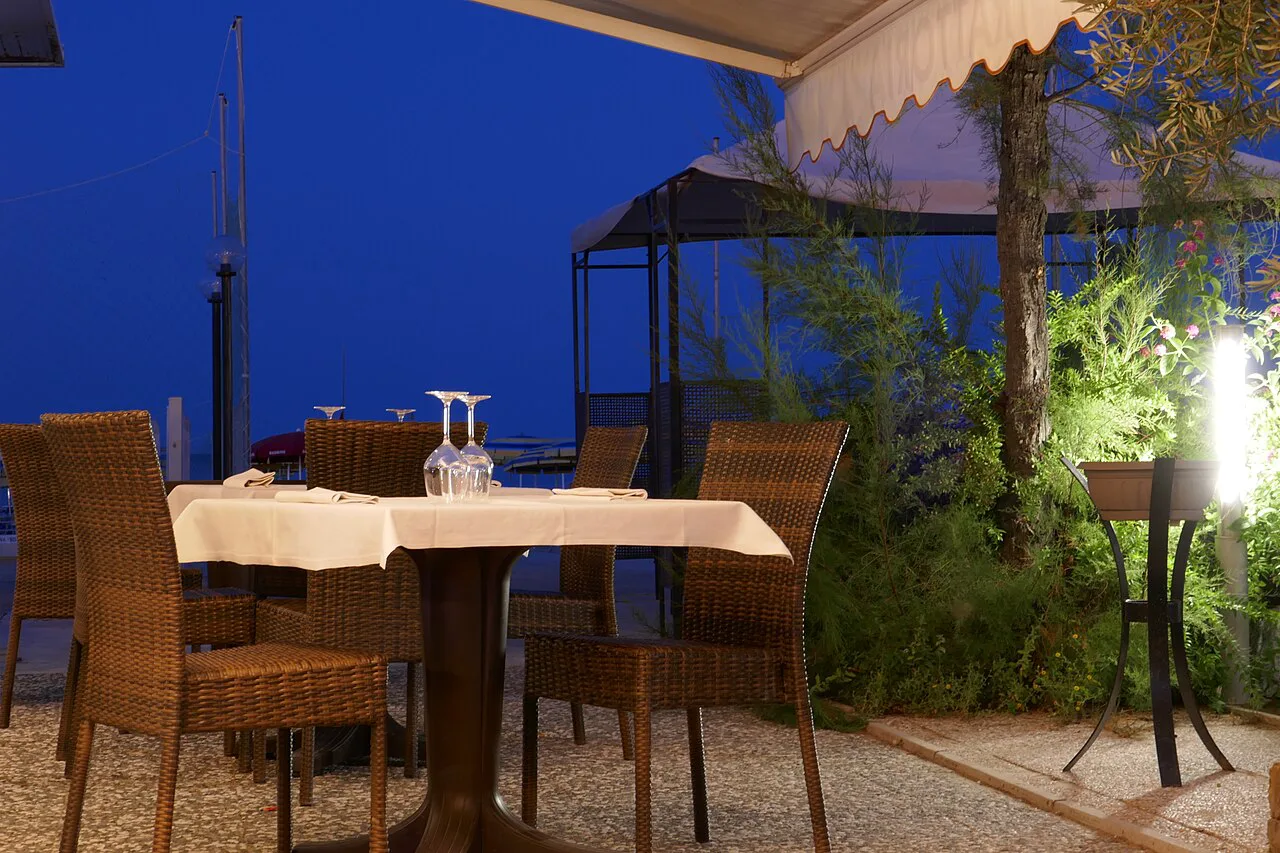 Outdoor restaurant table at night.