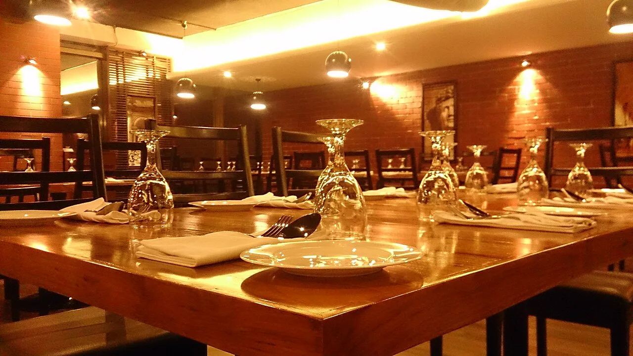 Restaurant table set for dinner.