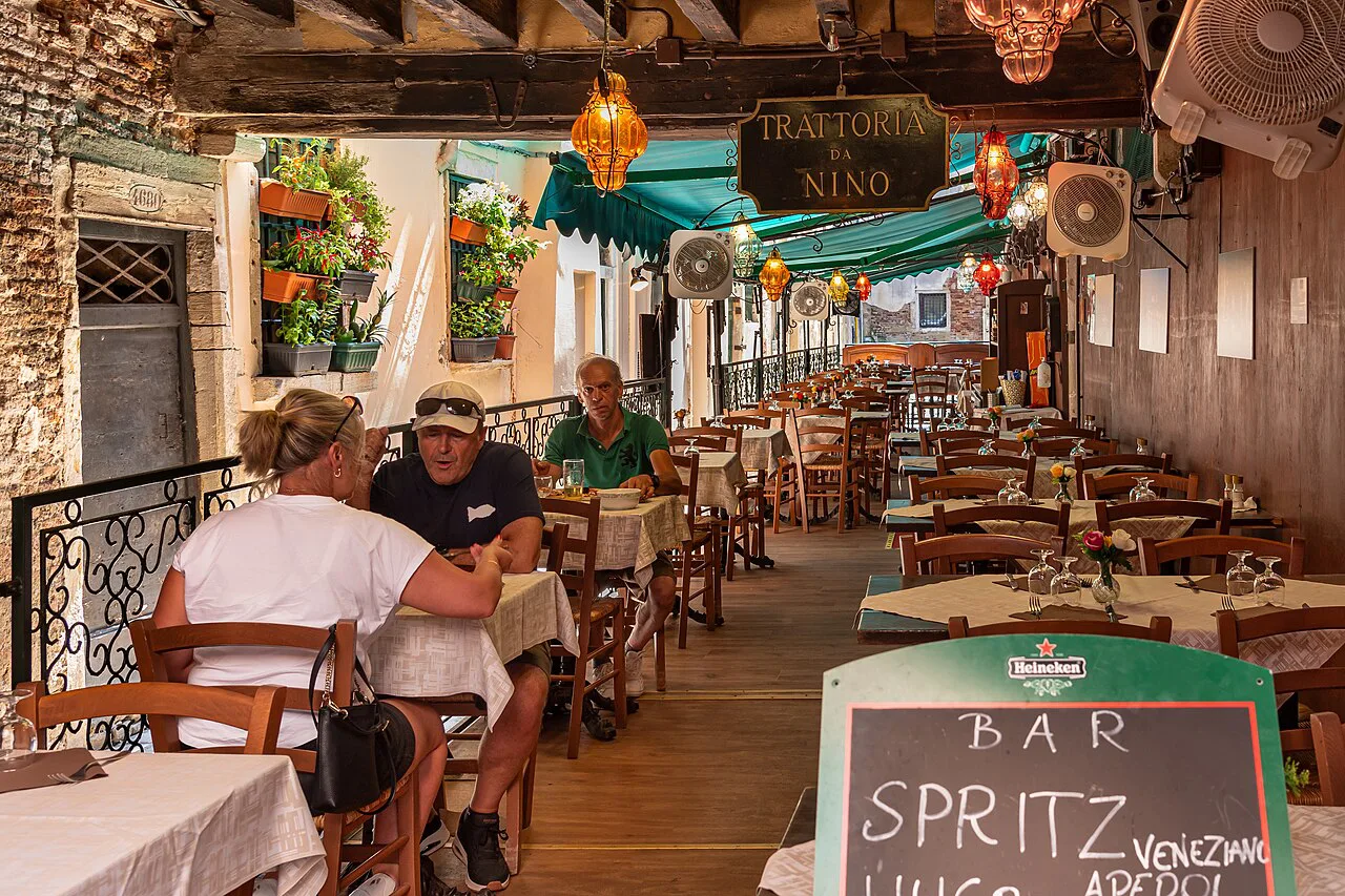 The covered terrace of a trattoria in Venice.