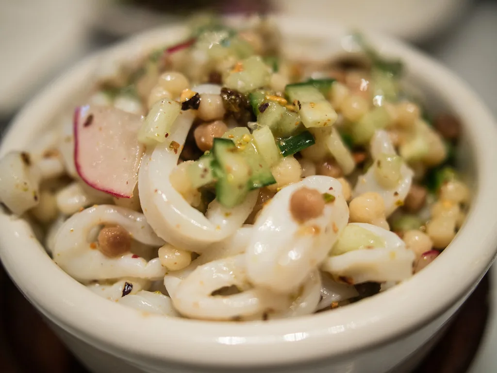 Fregola with squid, radish and cucumber.