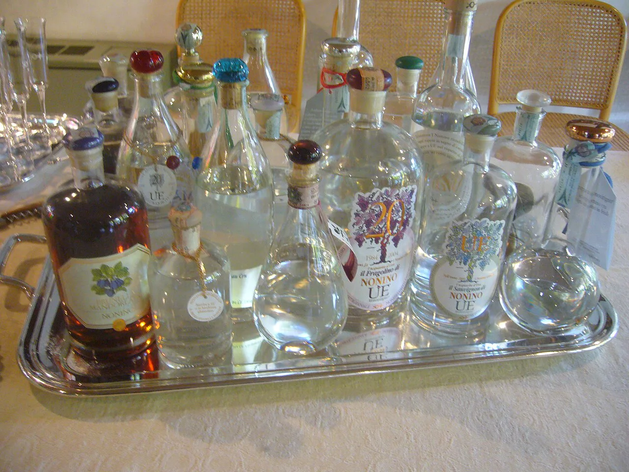A selection of grappa bottles on a tray.