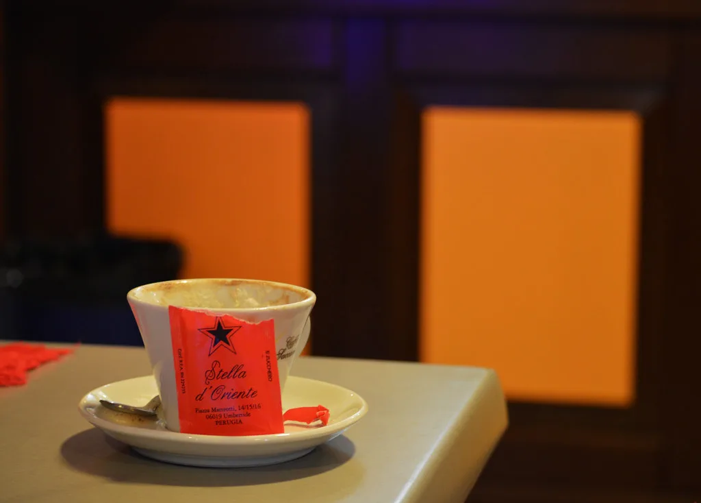 Espresso cup on a saucer at an Italian bar.