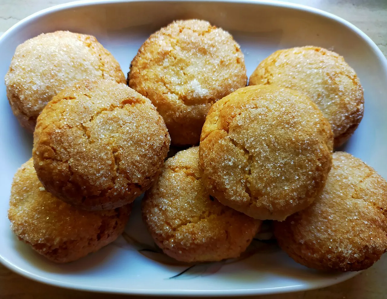 Amaretti biscuits on a plate.