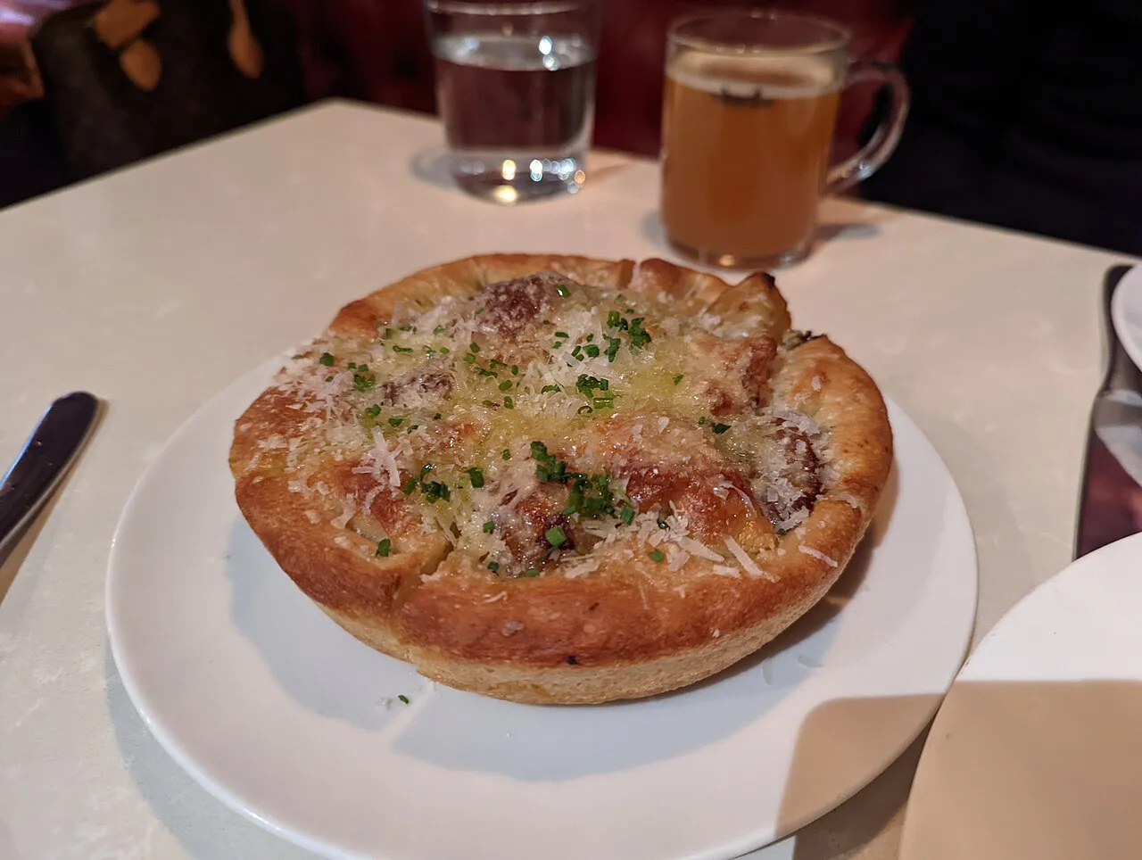 A baked focaccia on a plate.