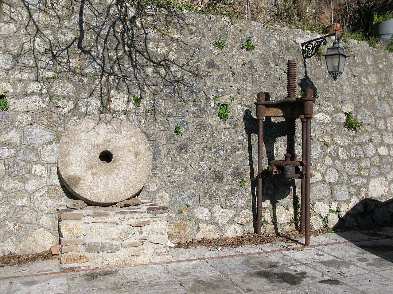 An old millstone and olive press.
