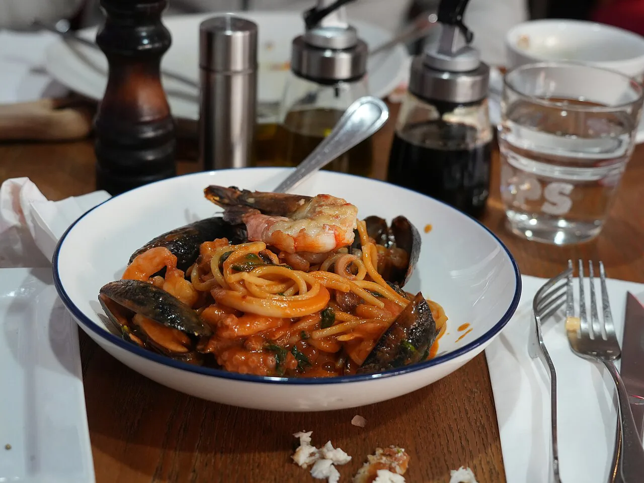A bowl of seafood pasta.