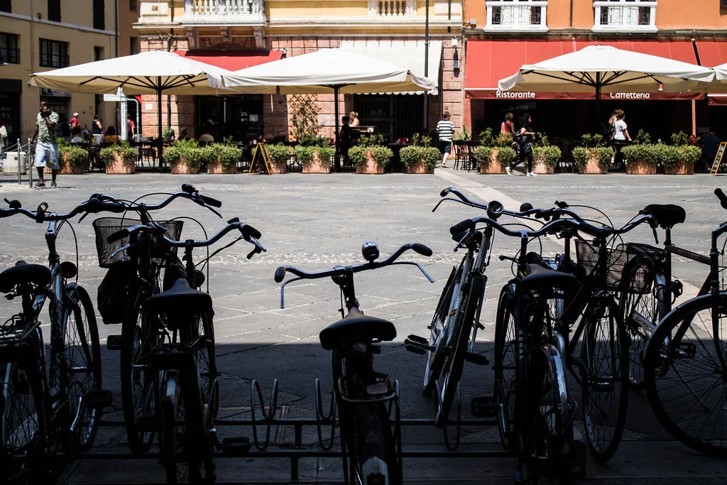 Café terraces and bicycles on Piazza del Popolo in Ravenna.