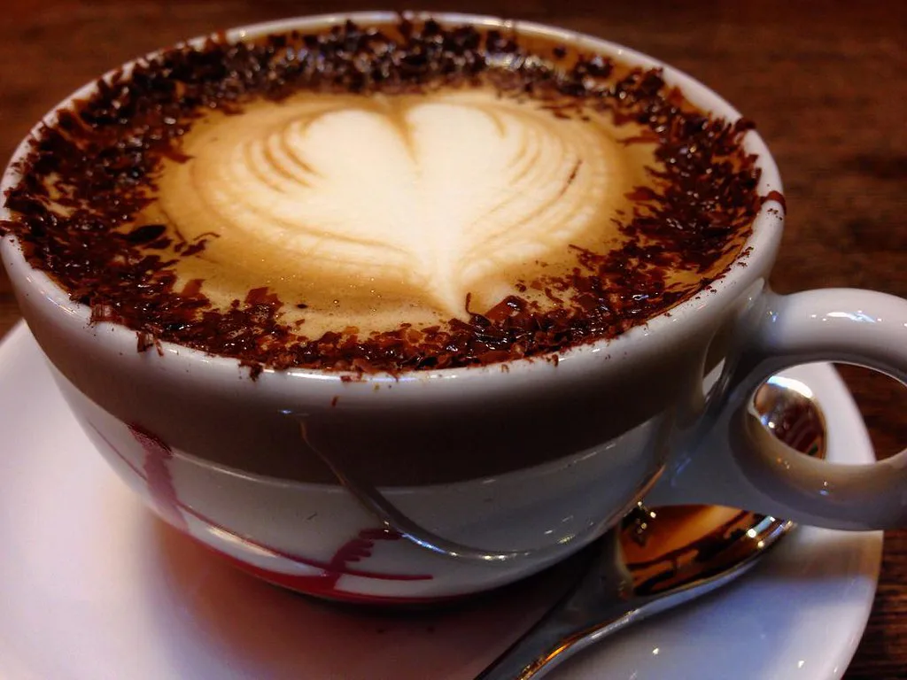 Marocchino topped with cocoa and a heart of milk foam.