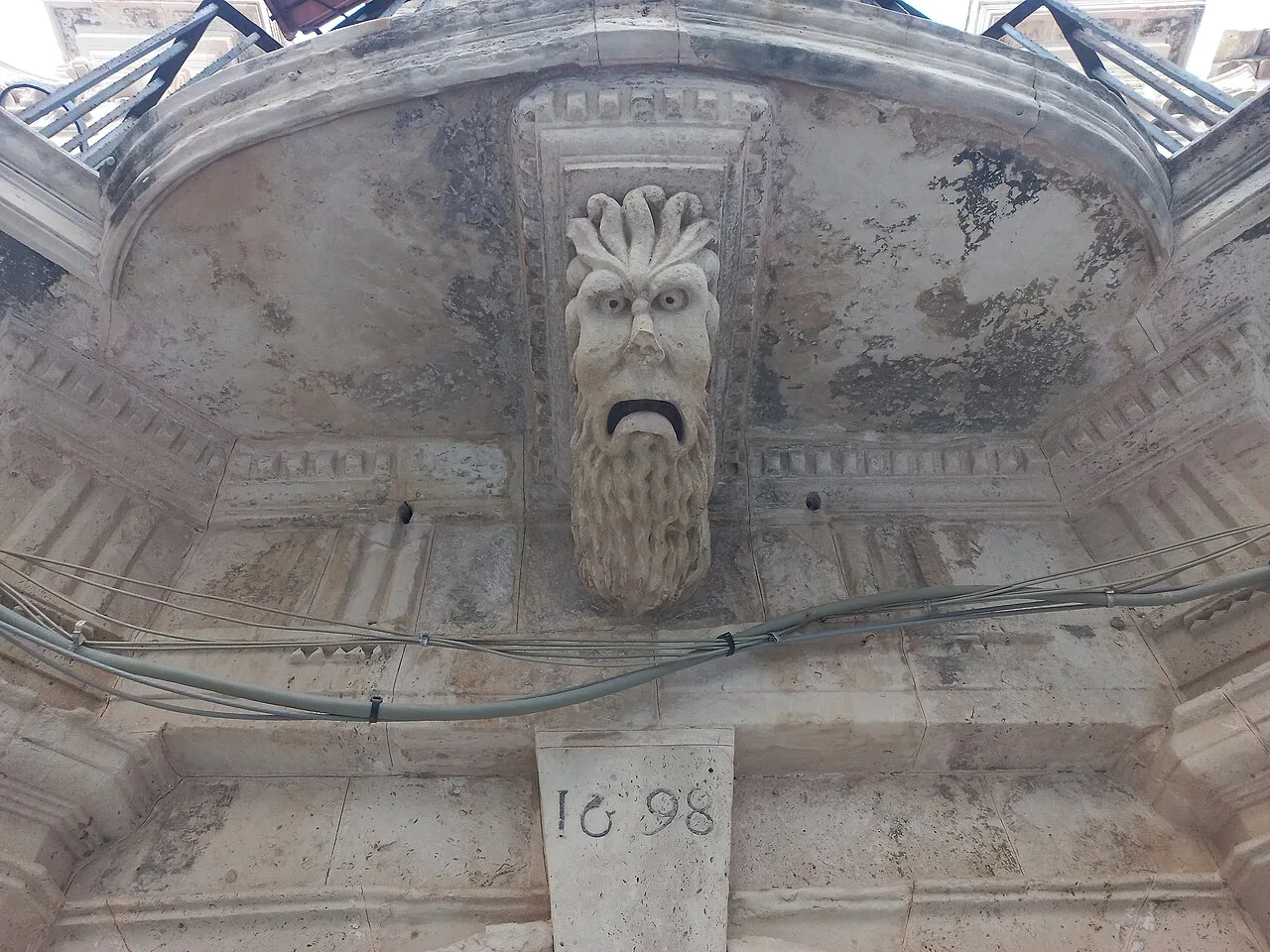 Carved mask on a palazzo in Syracuse's Giudecca.