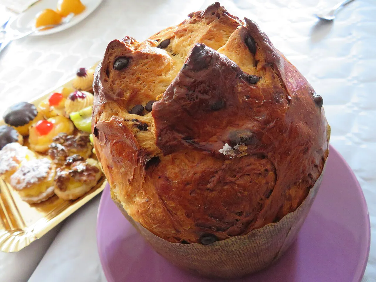 A panettone beside pastries.