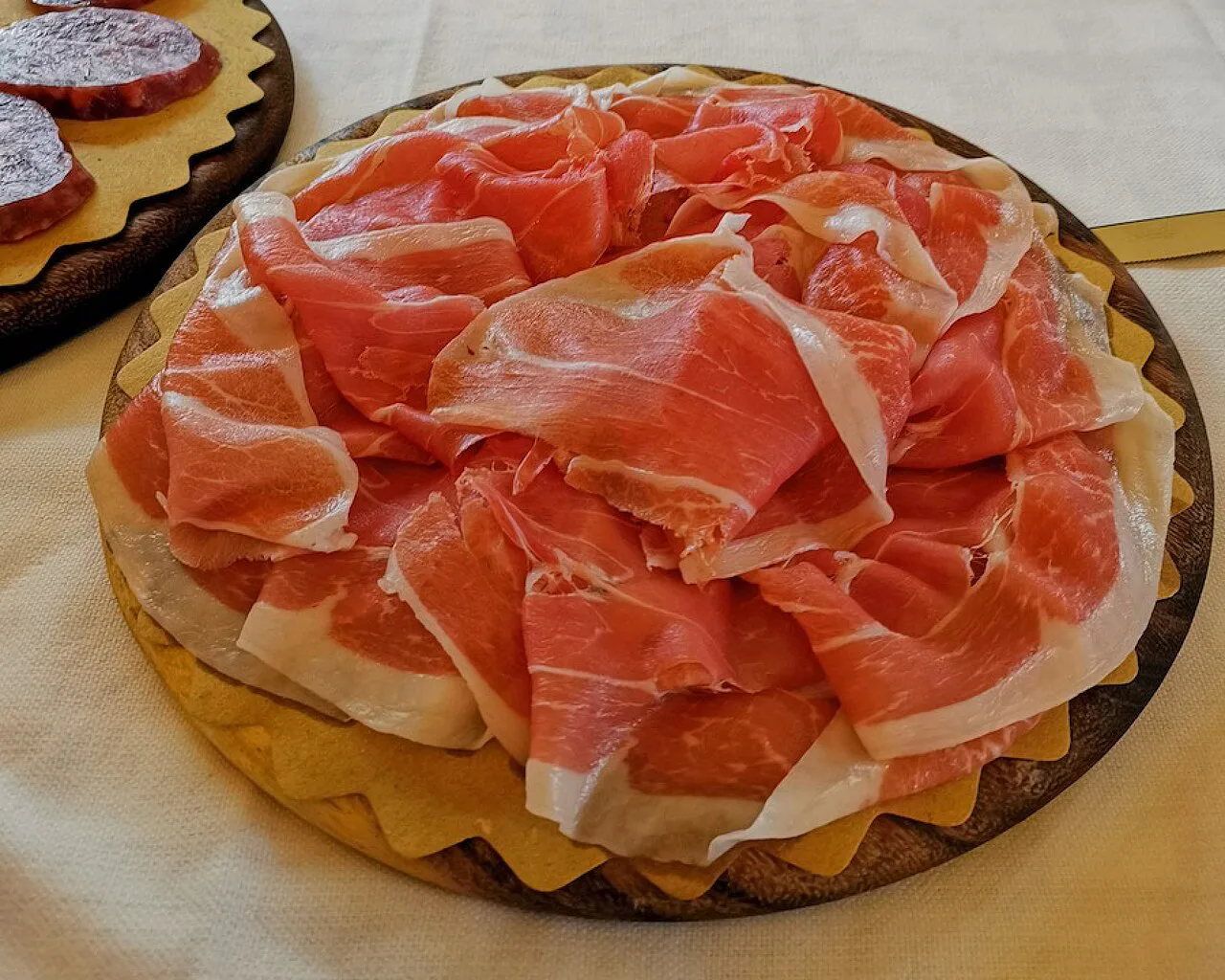 A platter of sliced prosciutto di Parma.