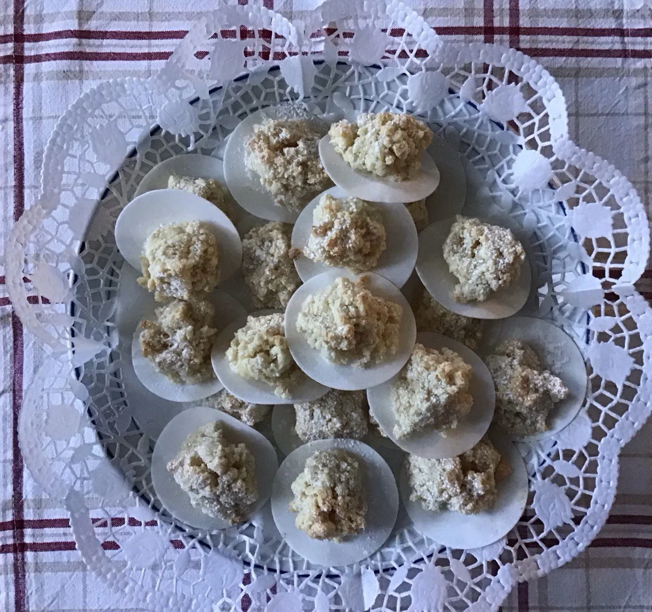 Ricciarelli biscuits on a lace doily.