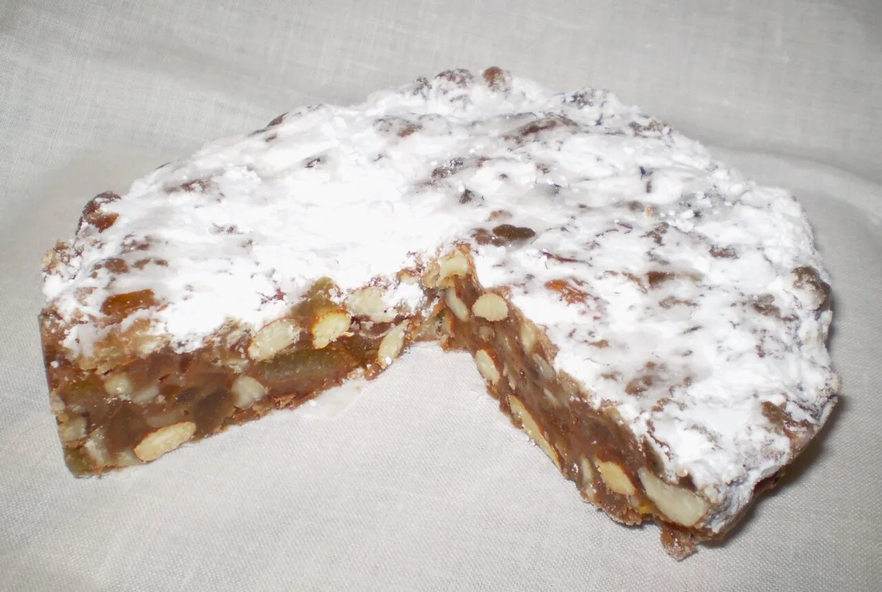Panforte dusted with icing sugar.
