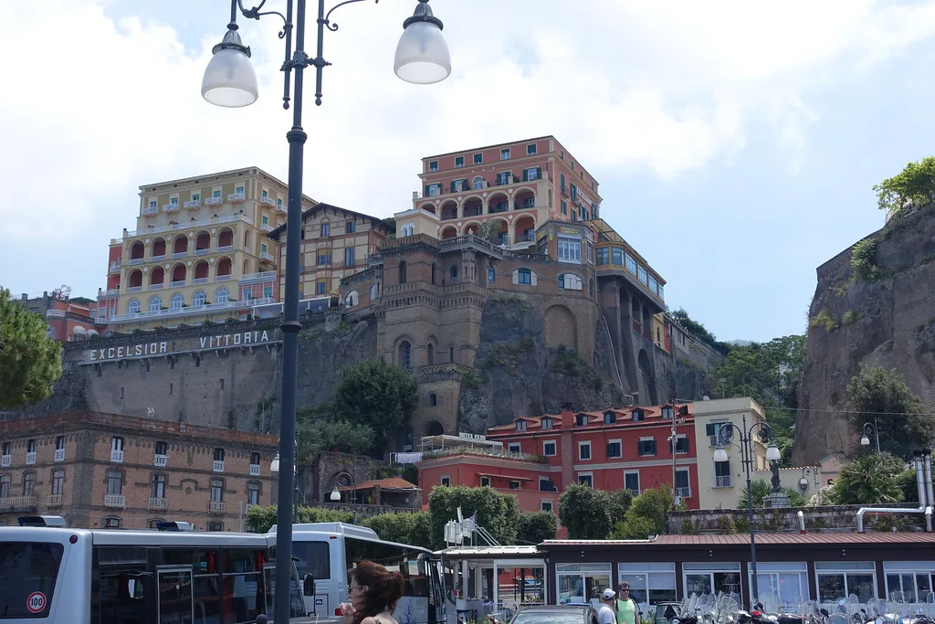 Sorrento seafront and cliffside hotels seen from Piazza dei Marinai d'Italia.