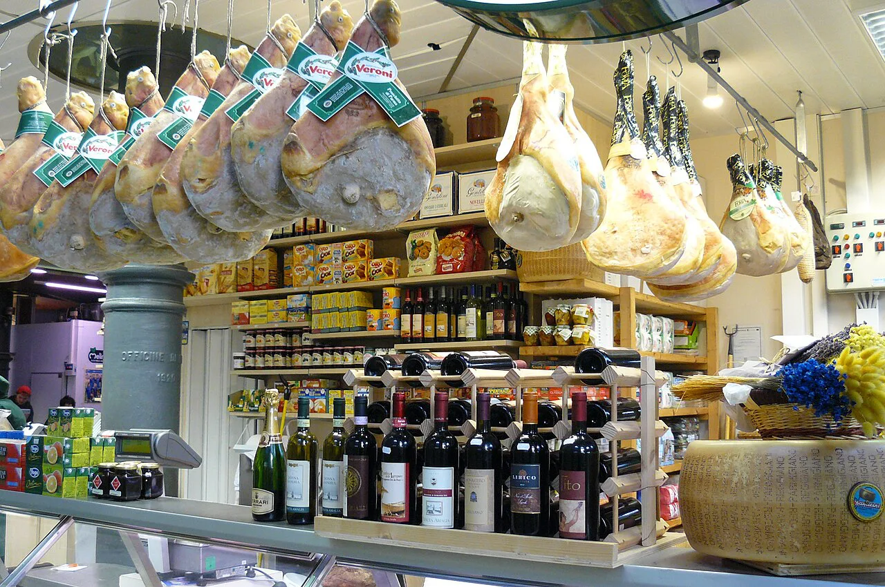 Cured hams and cheeses in a Ravenna food shop.