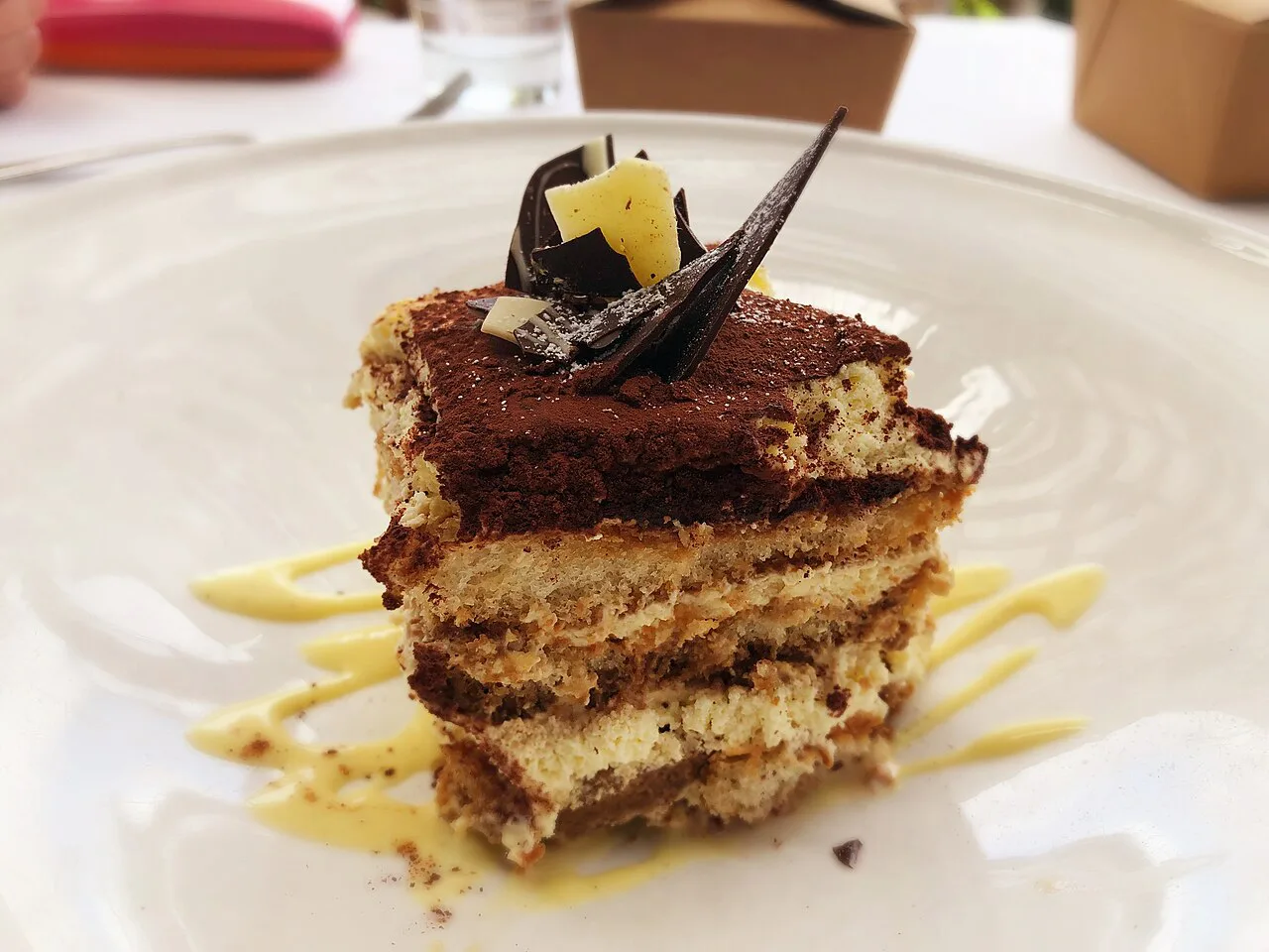 A layered tiramisu on a plate.